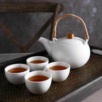 Ev seramik çay seti bir pot dört kap seti yaratıcı öğleden sonra çay fincanları Kung Fu Kamelya demlik
